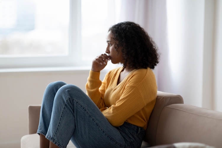 woman sitting alone focus