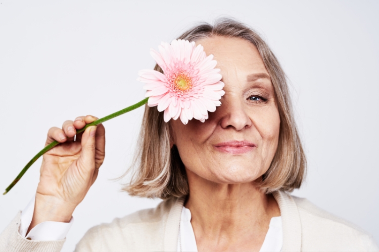 woman holding flower focus